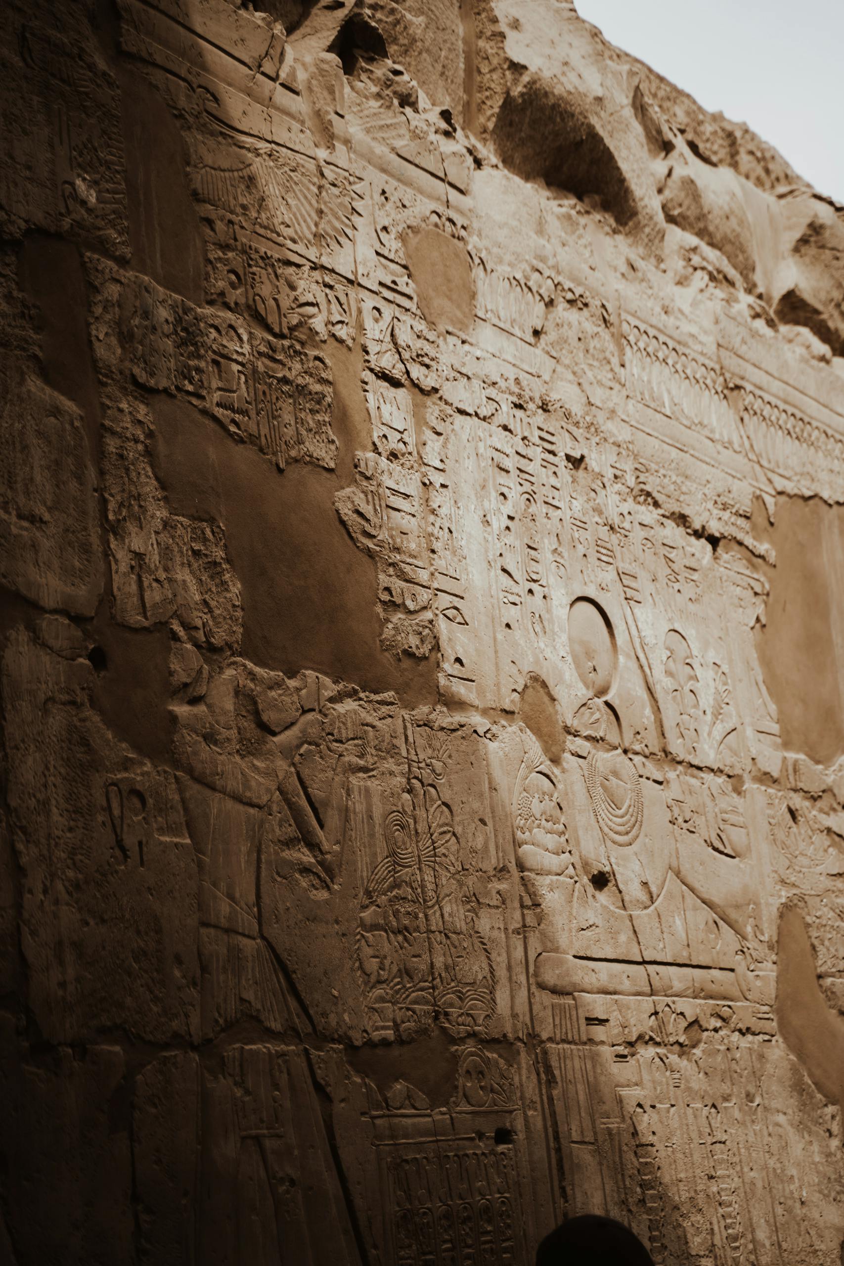 Detailed view of ancient carvings on the historic Luxor Temple walls in Egypt.
